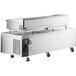 A stainless steel Cooking Performance Group chef base with a large stainless steel tray on top.