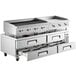 A large stainless steel Cooking Performance Group chef base with drawers under a griddle.