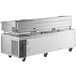 A stainless steel Cooking Performance Group chef base on wheels with drawers.