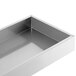 Stainless steel rectangular steps for a refrigeration cabinet.