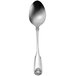 An Oneida Classic Shell stainless steel serving spoon with a design on the handle.