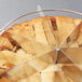 A close up of a pie with a stainless steel pie cutter in it.