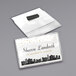 A white rectangular plastic card with a black clip and black text that says "City of Austin" with city skyline silhouettes on it.