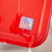 A red tray with a blue sticker for Noble Products Dissolvable Day of the Week Clock Labels on it.
