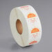 A roll of white paper with orange and white Noble Products clock labels.