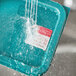 Noble Products Wednesday dissolvable food label in water on a plastic tray.