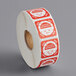 A roll of paper with red and white Noble Products Wednesday clock labels.