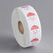 A roll of white paper with red and white Noble Products clock labels with the days of the week on them.