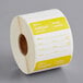 A roll of white and yellow paper with the words "Tuesday" and "Noble Products"
