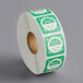 A roll of white and green Noble Products dissolvable day of the week clock labels.