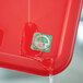 A red tray with a Noble Products Dissolvable Day of the Week Clock Label on it.