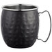 An Acopa Alchemy black metal Moscow Mule mug with a hammered finish and metal handle.