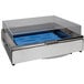 A Bon Chef stainless steel rectangular cold chafer with a food pan on a blue plastic surface.