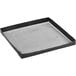 A black Baker's Mark square tray with mesh on it.
