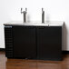 A black Beverage-Air kegerator with two beer taps on a counter.