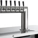 A Beverage-Air beer dispenser with six black tap handles.