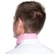 The back of a man wearing a light pink Intedge chef neckerchief.