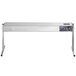 A silver stainless steel ServIt strip warmer with adjustable controls and legs on a white table.