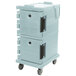 A slate blue Cambro Ultra Camcart for food pans with black handles on wheels.