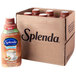 A brown Splenda container next to a brown plastic bottle of brown liquid.