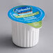 A case of Splenda Sugar-Free French Vanilla Creamer single serve cups with a white container and blue and green label.