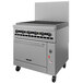 A large stainless steel Vulcan commercial gas range with a charbroiler on top.