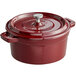 A Valor merlot enameled cast iron pot with a lid and handle.
