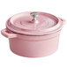 A Valor Himalayan salt enameled cast iron pot with a lid in pink.