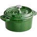 A Valor fern green enameled cast iron pot with a lid and handle.