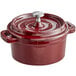 A red Valor enameled cast iron pot with a lid and handle.
