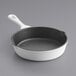 A Valor Arctic White enameled mini cast iron skillet with a black handle.