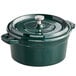 A Valor green enameled cast iron pot with a lid and handle.