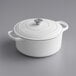 A Valor Arctic White enameled cast iron Dutch oven with a lid.