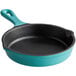 A Valor enameled mini cast iron skillet with a turquoise handle.