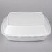 A Dart white foam hinged lid takeout container.