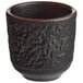 A black Acopa stoneware sake cup with a textured surface.