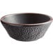 A black stoneware bowl with a brown rim.