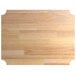 A Regency hardwood cutting board with a decorative edge.