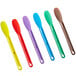 A Choice 6-piece set of colorful sandwich spreaders with yellow, red, green, blue, white, and brown handles.