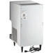 A white rectangular Hoshizaki countertop ice maker and water dispenser with a cord attached.