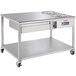 A stainless steel 48" donut finishing table with 1 drawer and wheels.