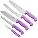 A group of Choice knives with purple handles on a counter.
