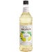 A close up of a Monin Lemon Syrup bottle.