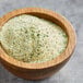 A bowl of Lawry's garlic salt with parsley.