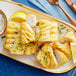 A plate of fried fish with Zatarain's Seasoned Fish Fri Breading Mix and a lemon wedge.