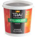 A container of THAI Kitchen green curry paste.