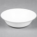 A Homer Laughlin bright white china bowl with a white rim on a gray surface.