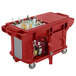 A red Cambro Versa Ultra work table with storage and heavy-duty casters.