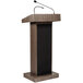 An Oklahoma Sound Ribbonwood lectern with a microphone.