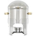 A Vollrath stainless steel sauce chafer with brass trim.